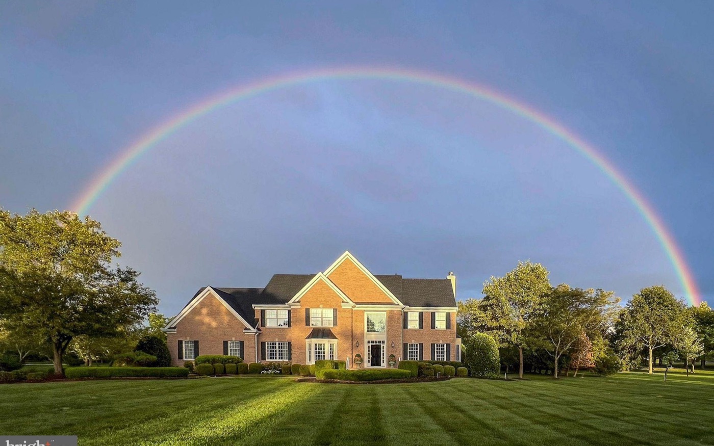 Hunters Ridge home beneath a rainbow
