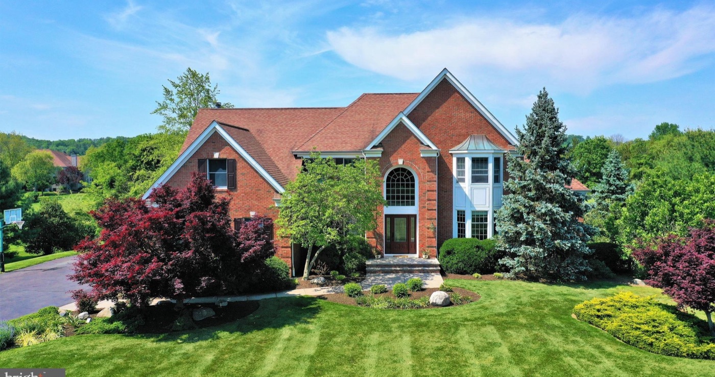 Landscaped brick home in Hunters Ridge